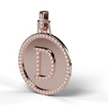 Diamond initial D medallion pendant in 14K rose gold, angled view