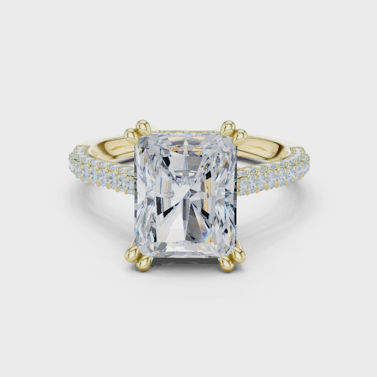 3 carat radiant cut hidden halo engagement ring in yellow gold, 360° view